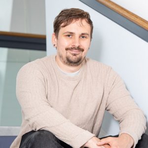 Andrew Widdowson sat on a flight of stairs