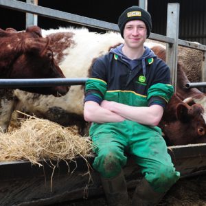 Ashley Slater sat by some cows