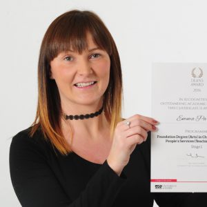 Emma Parker holding her award