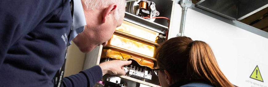 Lecturer showing boiler